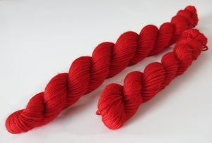 bright solid fairytale red sock yarn mini skein for knitting and crochet