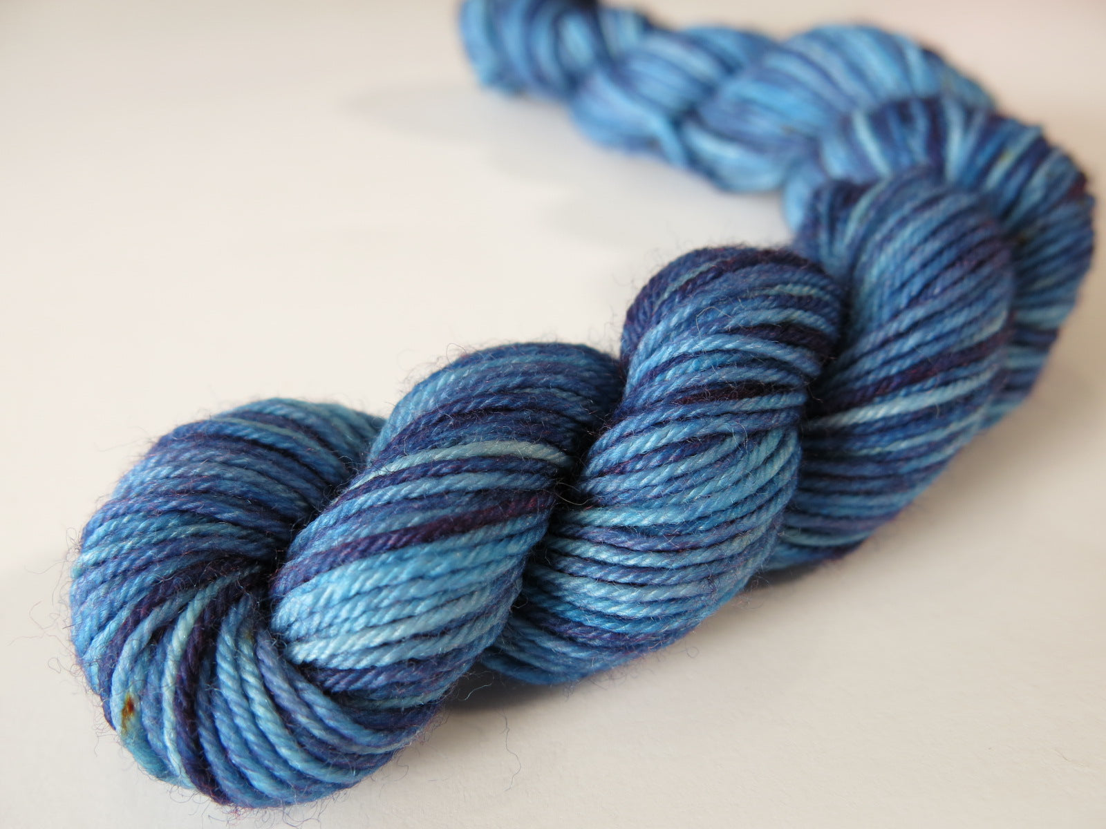 dark tonal blue 4 ply sock yarn mini skein for knitting and crochet