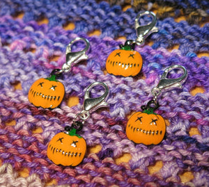 orange enamel jack o lantern halloween stitch markers on lobster clasps
