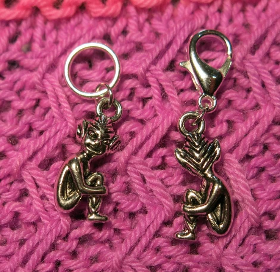 silver alloy stitch marker with a sitting fairy elf