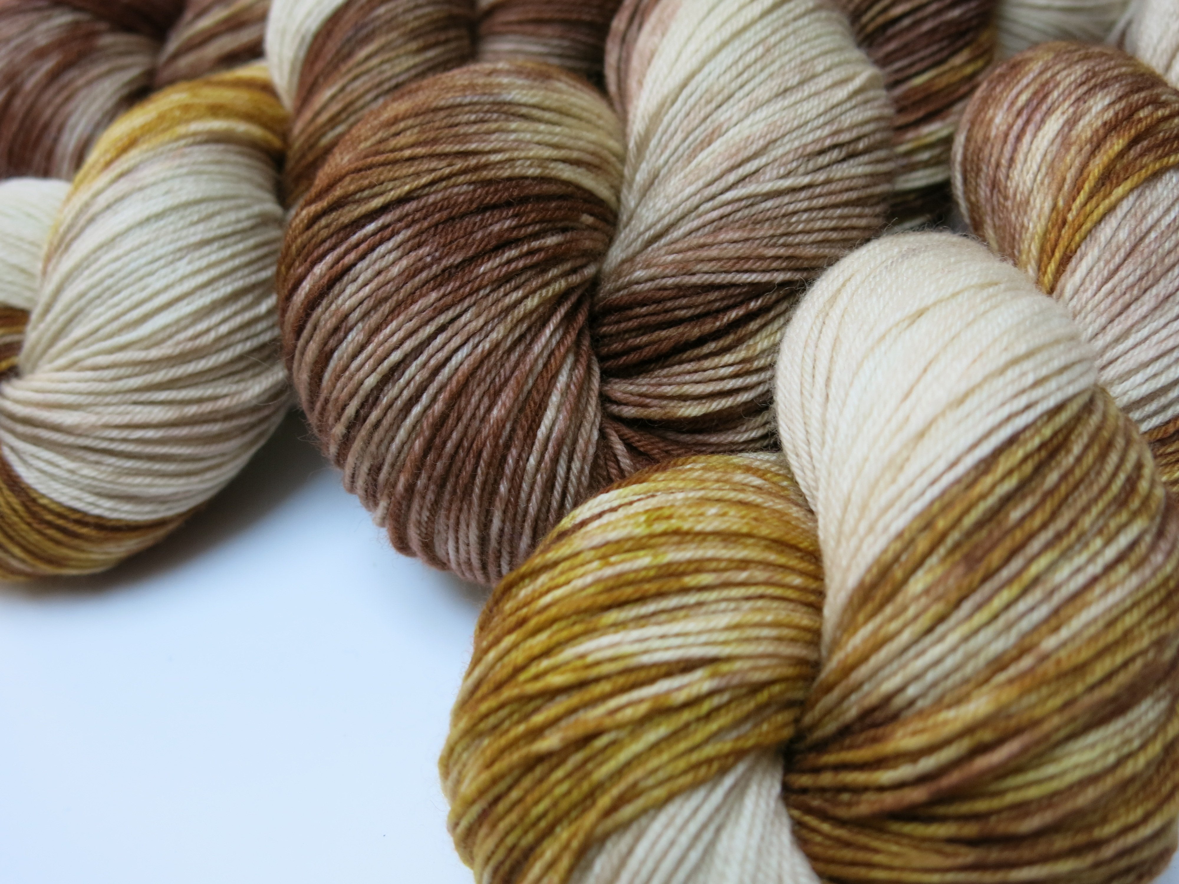 new mexico bull snake inspired indie dyed yarn in browns and creams