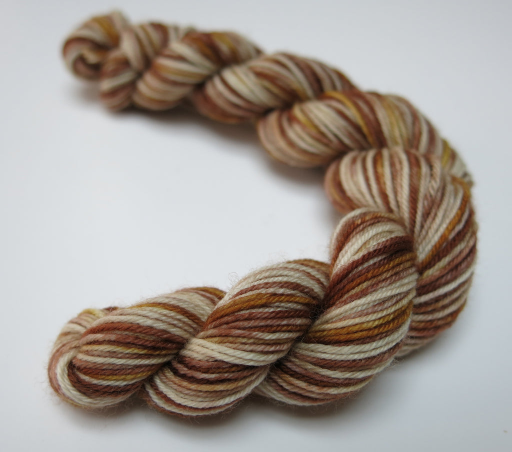 20g sock yarn mini skein is browns and creams by my mama knits
