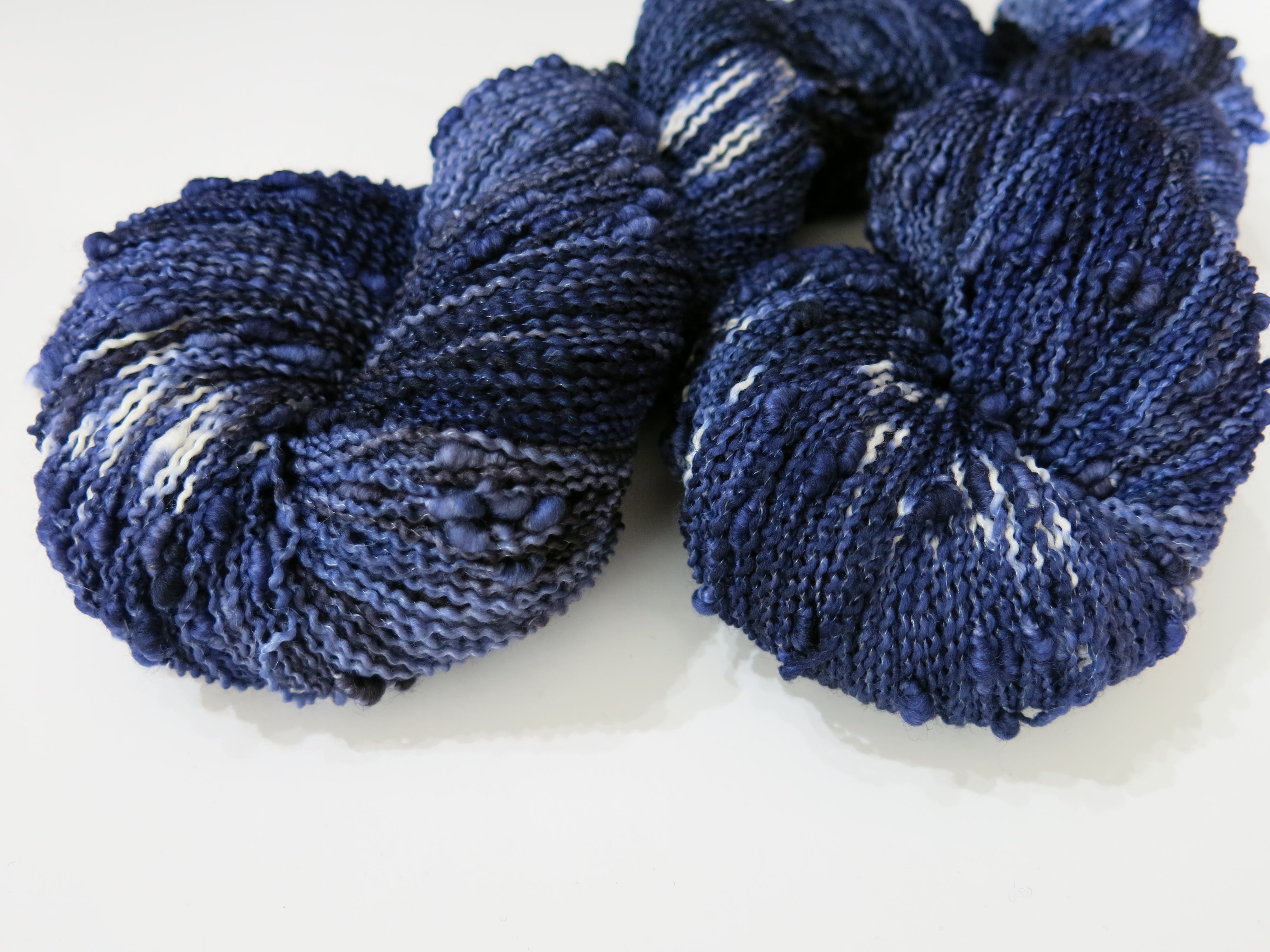 dark blue slub yarn with white pops for knitting and crochet