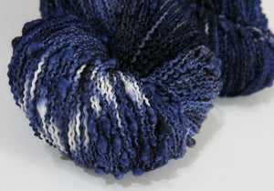 indie dyed night sky coloured slub yarn in dark blues with pops of white stars