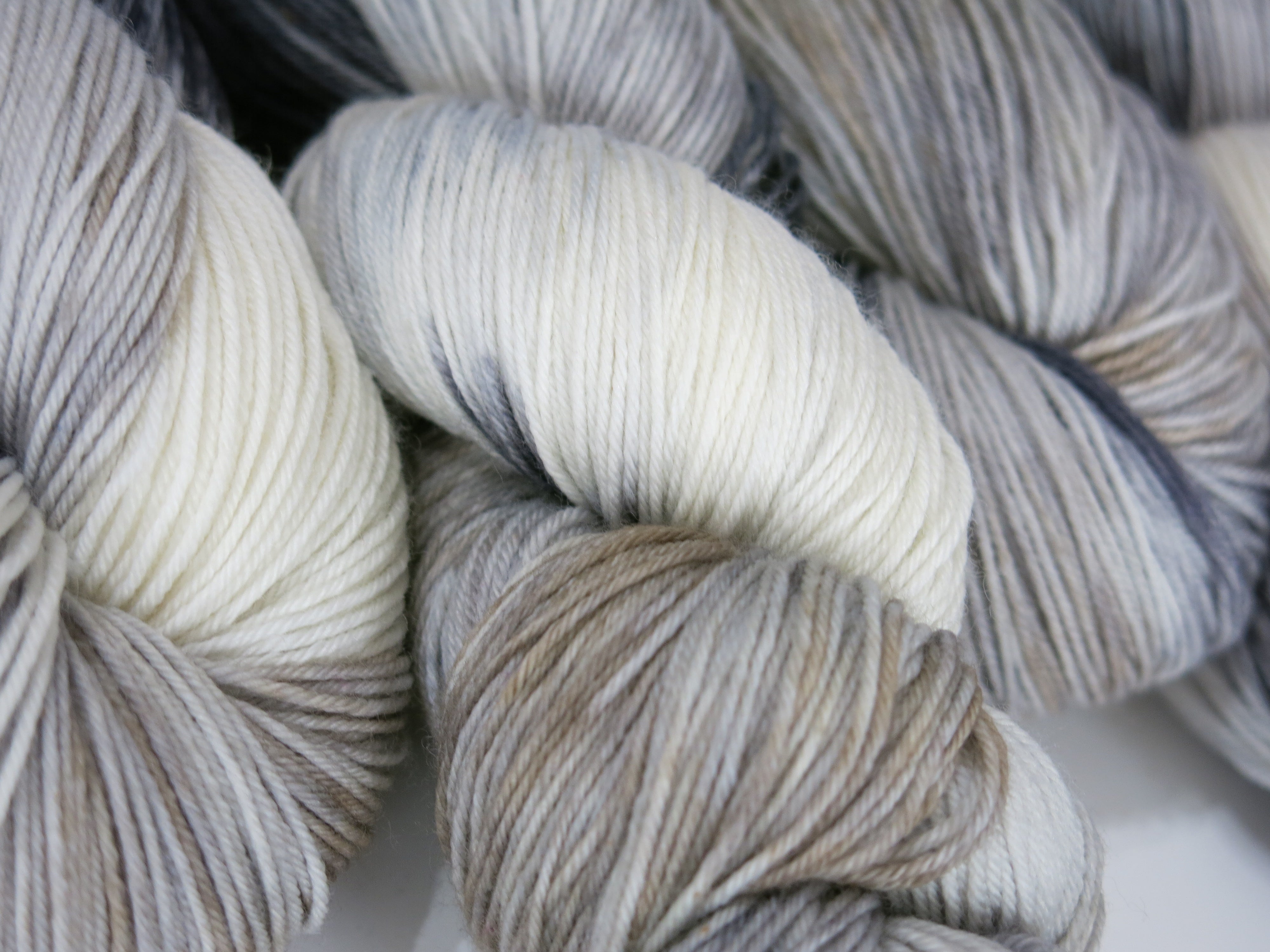 horse colored grey white and tan sock yarn skeins by my mama knits
