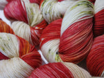 red toadstool mushroom yarn skeins with speckles and cream