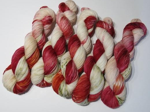 fly argaric red and cream sock yarn skeins
