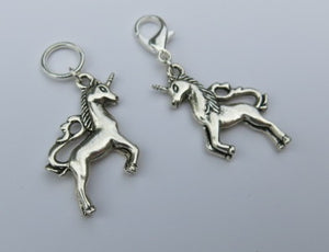 double sided silver coloured unicorn stitch marker on a lobster clasp