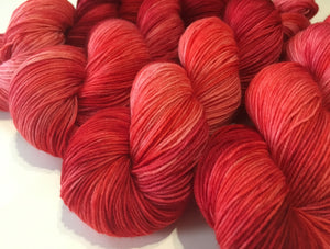 indie dyed strawberry red sock yarn with nylon for knitting and crochet