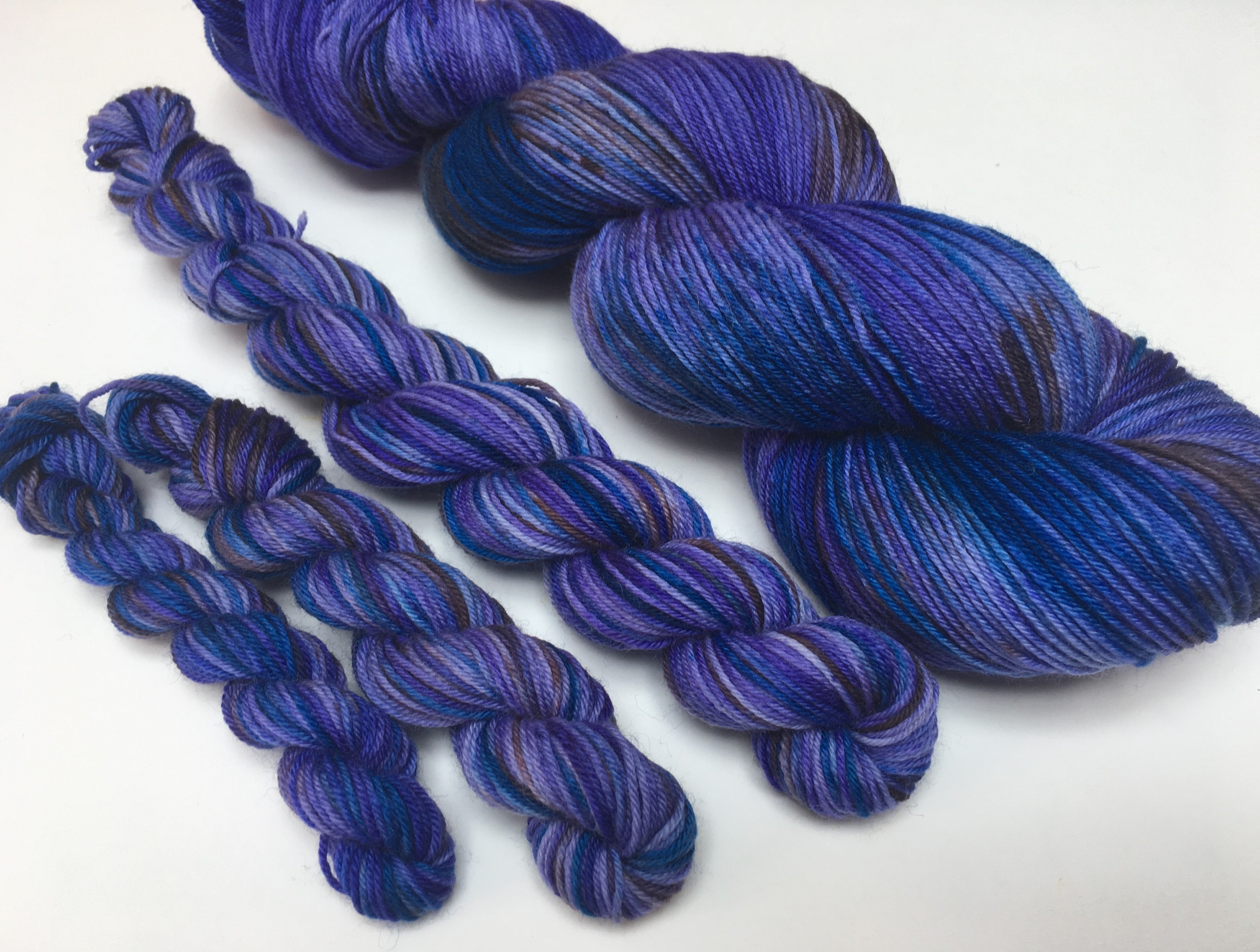 hand dyed blue and purple superwash sock yarn skeins