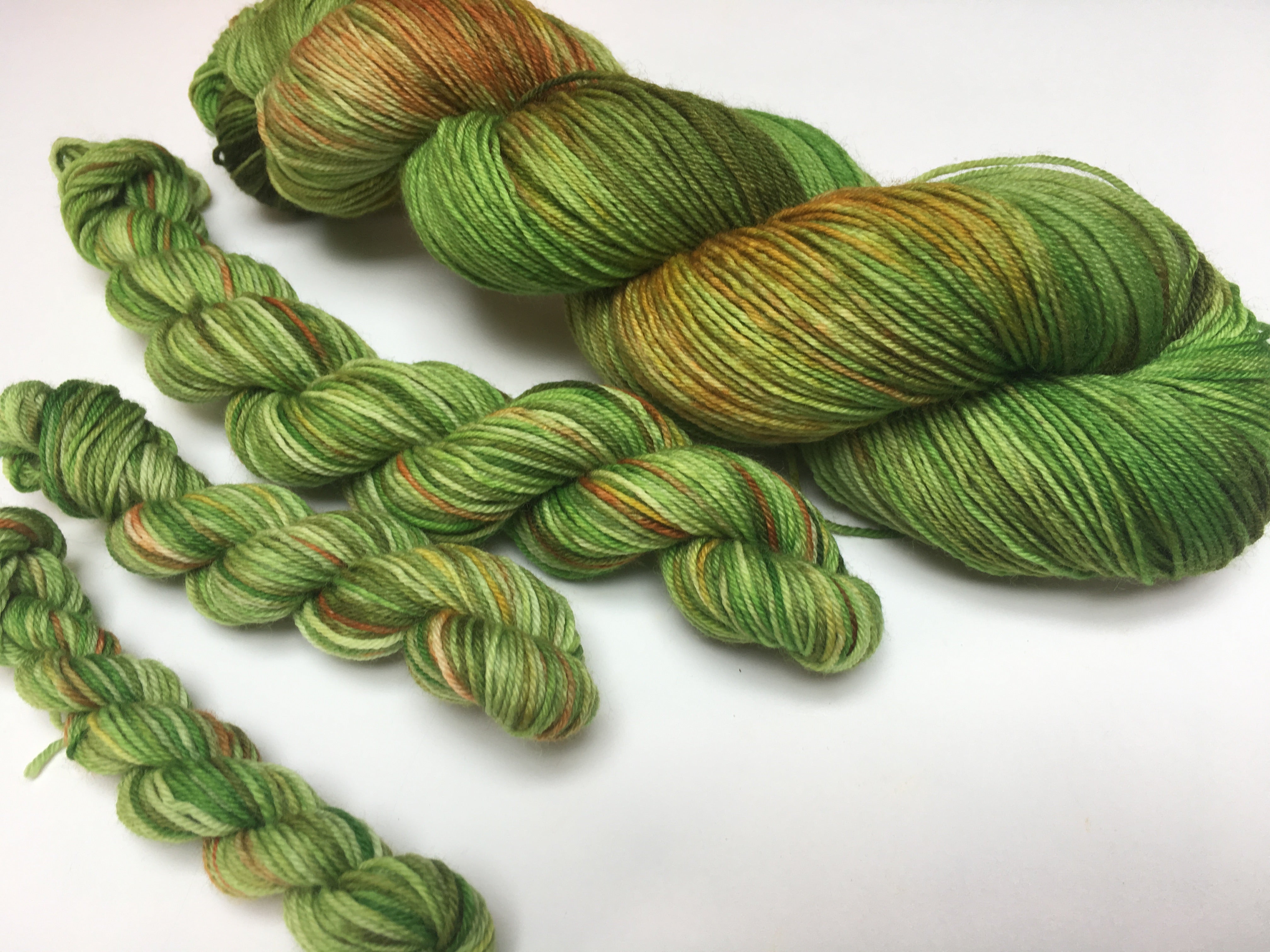 green hand dyed merino yarn skeins for knitting and crochet projects