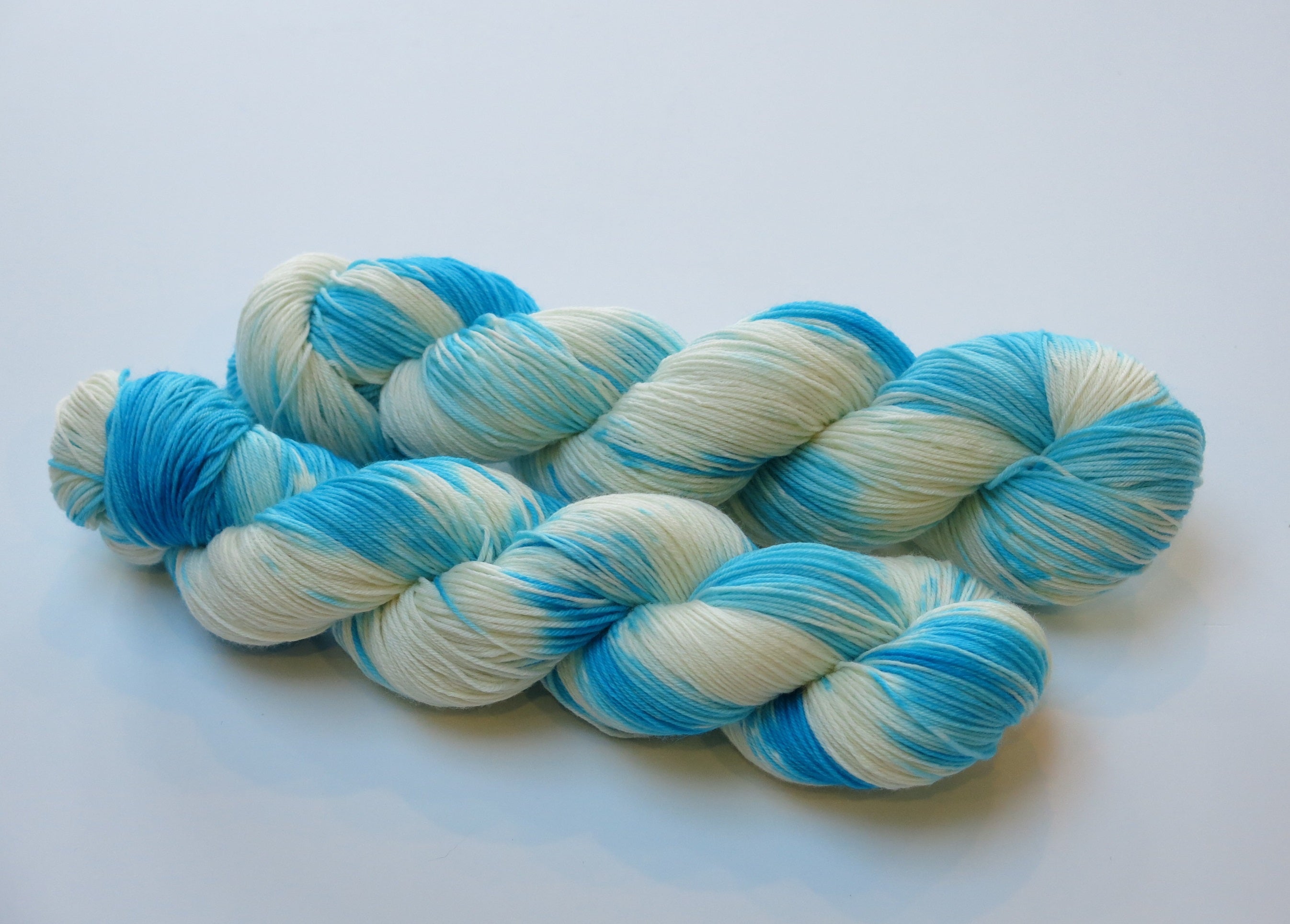 indie dyed turquoise and white choufunga sock skeins