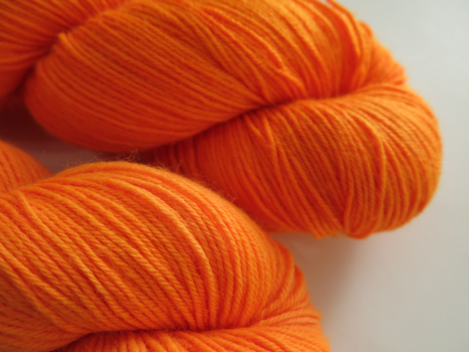 hand dyed black light orange wool by indie dyer my mama knits