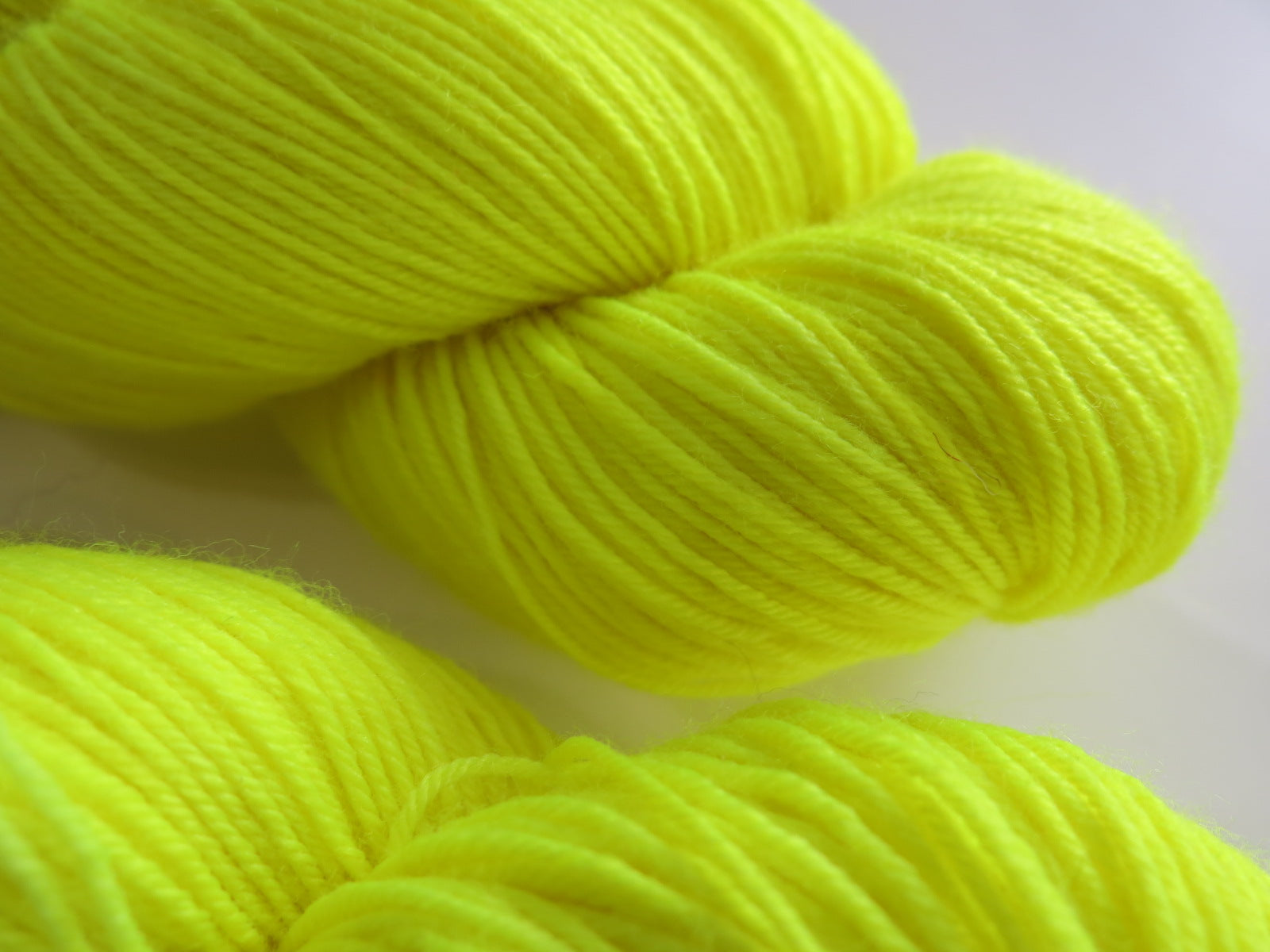 neon fluorescent yellow sock yarn by my mama knits
