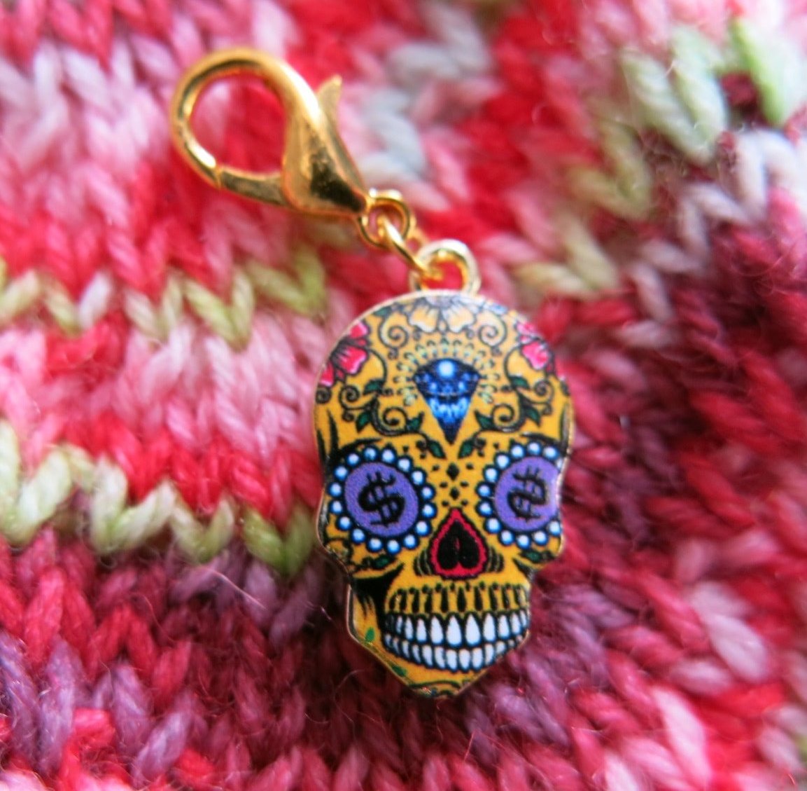 yellow dollar sign sugar skull charm for place keeping in crochet