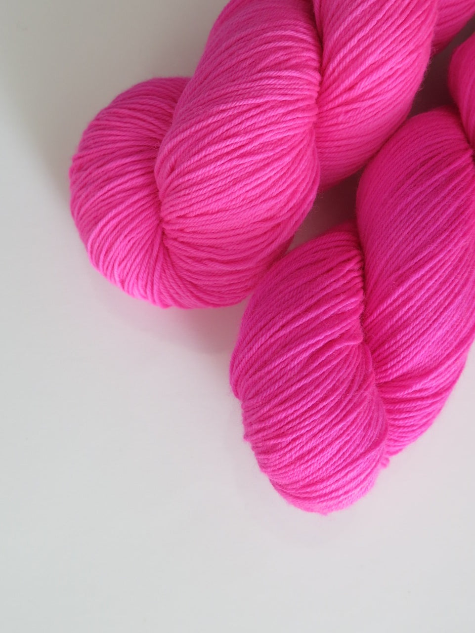 neon pink yarn skein for knitting and crochet