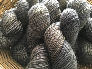 hand dyed tonal black and grey blue faced leicester yarn skeins