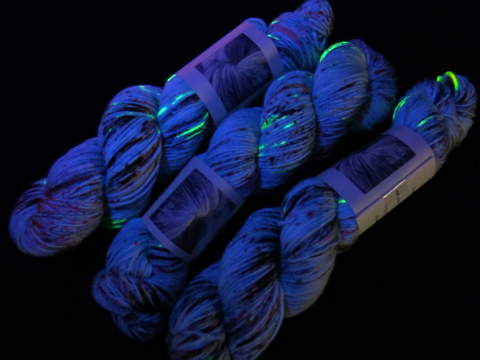 uv reactive yarn fluorescing under black light